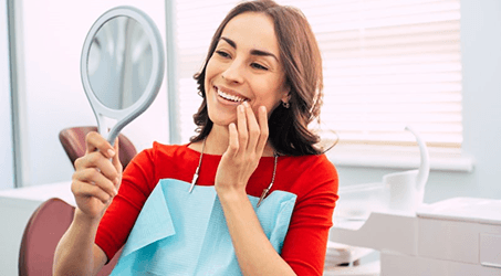 a woman receiving her dental implants in Springdale