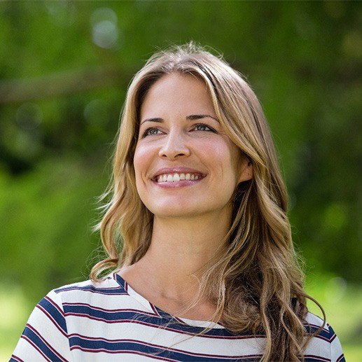 A beautiful, smiling woman looking into the distance