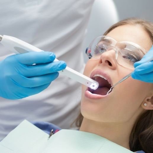 Dentist using intraoral camera to capture smile photos