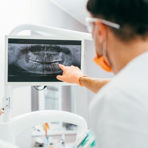 Dentist looking at all digital x rays