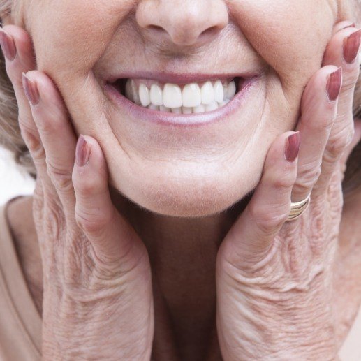 Smiling woman enjoying the benefits of dental implants