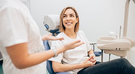 Dentist talks with patient