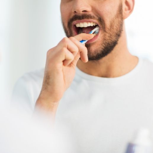 Man brushing teeth