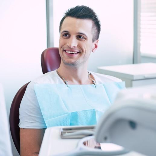 Dentist explaining wisdom tooth extraction aftercare to dental patient