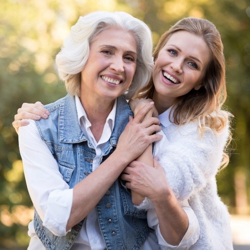 Two women smiling after Invisalign