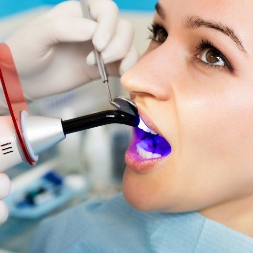 Dentistry patient receiving cosmetic dental bonding