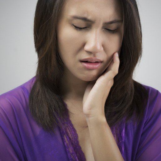 Woman in pain before emergency dentistry