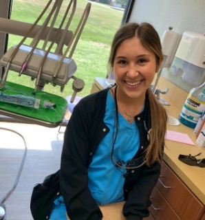 Friendly Springdale dental team member smiling in dental treatment room