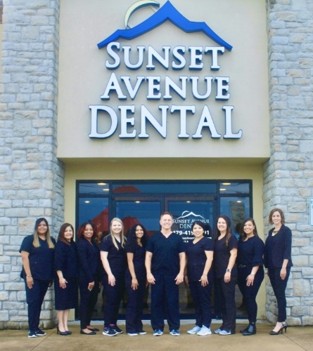 staff standing in front of dental office in springdale