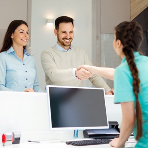 Man speaking to a receptionist