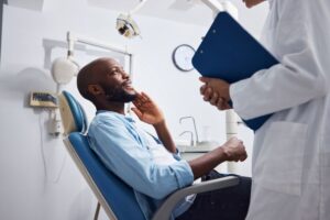 Dentist and patient talking during consultation