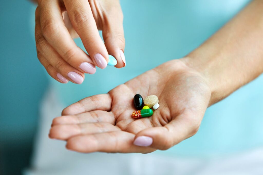 A woman taking vitamins
